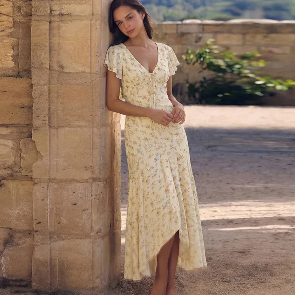 Robe asymétrique à volants et imprimé floral jaune pâle