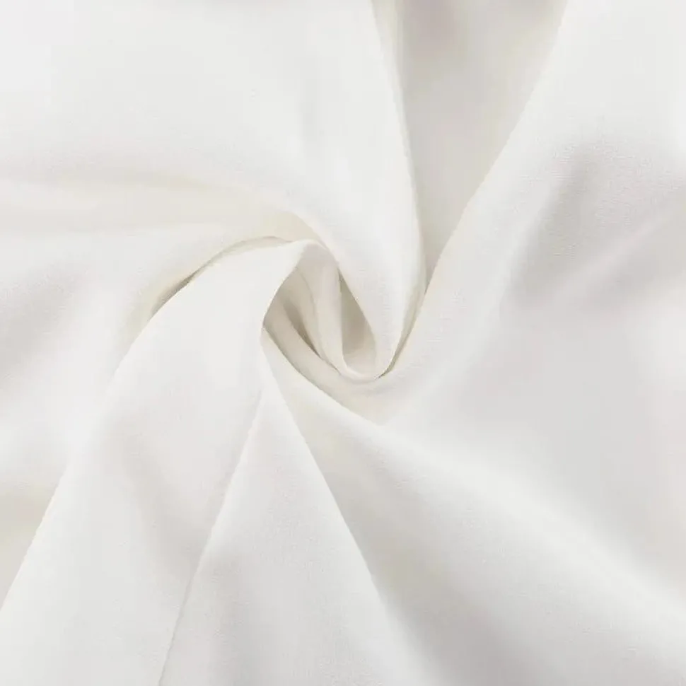 Robe courte blanche à manches longues avec fausses poches