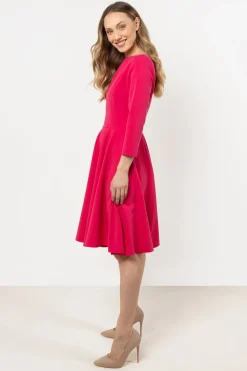 Robe de cocktail rose évasée manches longues